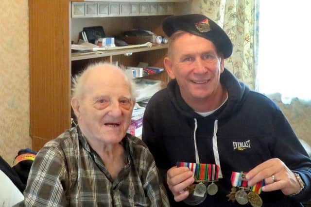 Pompey legend Alan Knight makes a surprise visit to Second World War veteran Charlie Pratt, 93, at his home