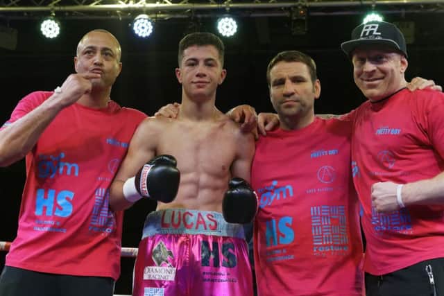 Lucas Ballingall celebrates his success with his trainer father Michael Ballingall, left, Leigh Park's former British, Commonwealth and WBU light-heavyweight champion Tony Oakey and trainer Gavin Jones, right. Picture: Neil Marshall (1713340-750)