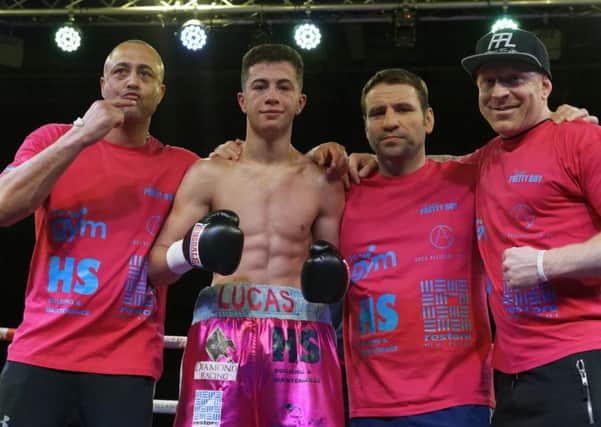 Lucas Ballingall celebrates his success with his trainer father Michael Ballingall, left, Leigh Park's former British, Commonwealth and WBU light-heavyweight champion Tony Oakey and trainer Gavin Jones, right. Picture: Neil Marshall (1713340-750)