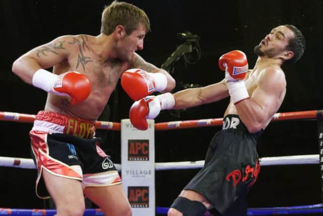Floyd Moore on the attack against Ivan Godor. Picture: Neil Marshall (1713340-411)