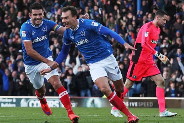 Kal Naismith celebrates scoring Pompeys winner against Plymouth on Saturday following a mistake from Pilgrims keeper Remi Matthews, right