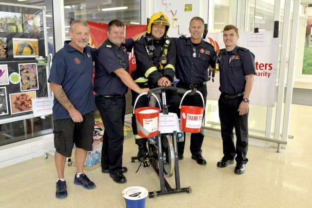 Jasper Taylor with colleagues on a recent fundraising exploit where he cycled 200 static miles for charities