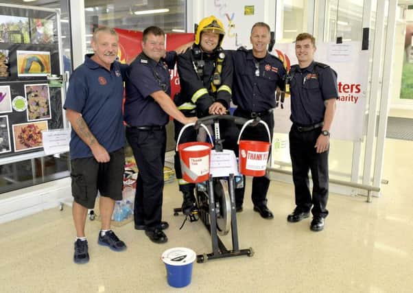 Jasper Taylor with colleagues on a recent fundraising exploit where he cycled 200 static miles for charities