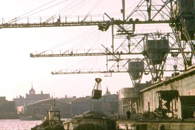 Another photograph from Gower Lloyd book showing Fraser & Whites cranes at work.