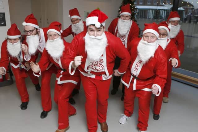 Staff of the Mary Rose Museum dressed in Santa suits at the museum.
Picture: Habibur Rahman