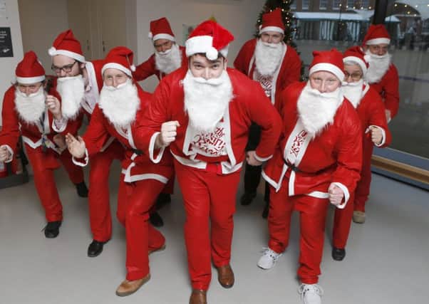 Staff of the Mary Rose Museum dressed in Santa suits at the museum.

Picture: Habibur Rahman