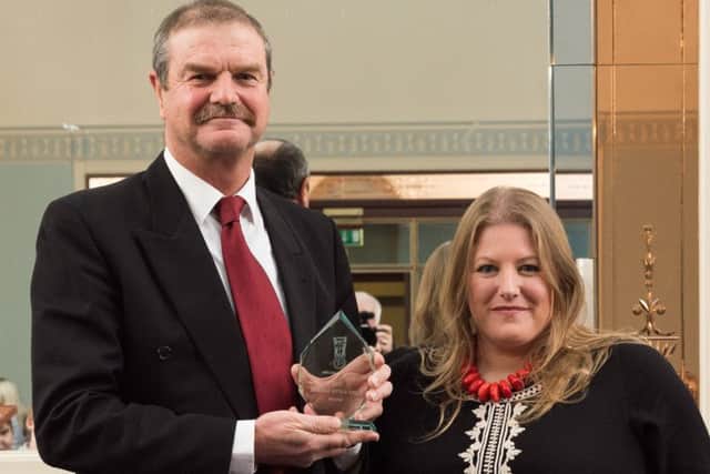 Julian Brown from Horndean Technology College receives the Service With a Smile Award from leader of Portsmouth City Council, Cllr Donna Jones. Picture: Vernon Nash