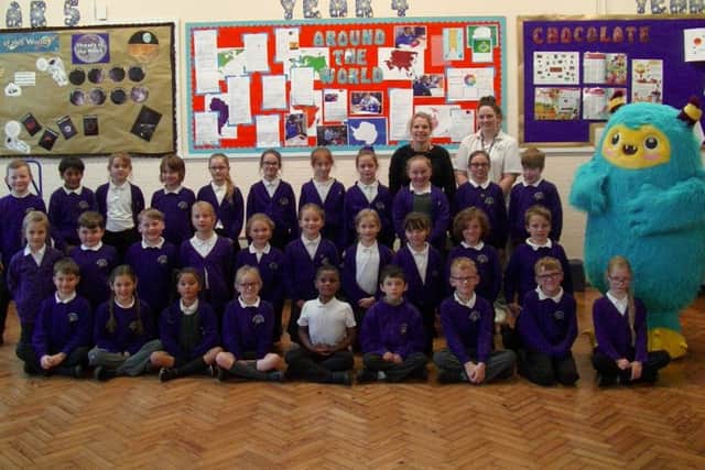 Wimborne Juniors class 4AM with their class teachers and Stomper. The school took part in a walking to school scheme by Portsmouth City Council
