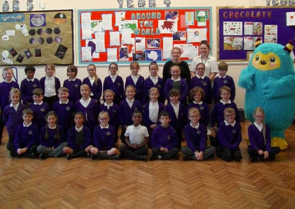 Wimborne Juniors class 4AM with their class teachers and Stomper. The school took part in a walking to school scheme by Portsmouth City Council