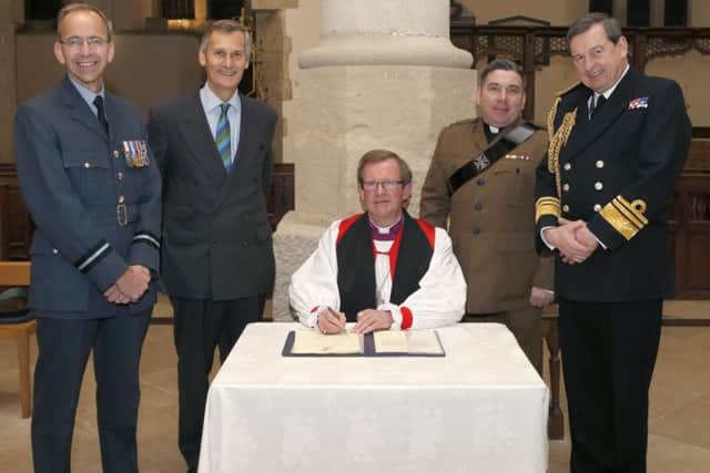 From left: Air Commodore Alan Opie from the Royal Air Force; Lord-Lieutenant of Hampshire Nigel Atkinson; Anglican Bishop of Portsmouth the Rev Christopher Foster; The Rev Ian Stevenson and Second Sea Lord Vice Admiral Jonathan Woodcock signing the Armed Forces Covenant  at Portsmouth Anglican Cathedral   
Picture: Habibur Rahman