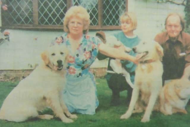Janet Cooper with her beloved retriever Trudy, left, daughter Elaine Markley and husband Frank