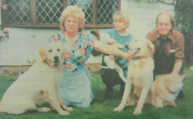 Janet Cooper with her beloved retriever Trudy, left, daughter Elaine Markley and husband Frank