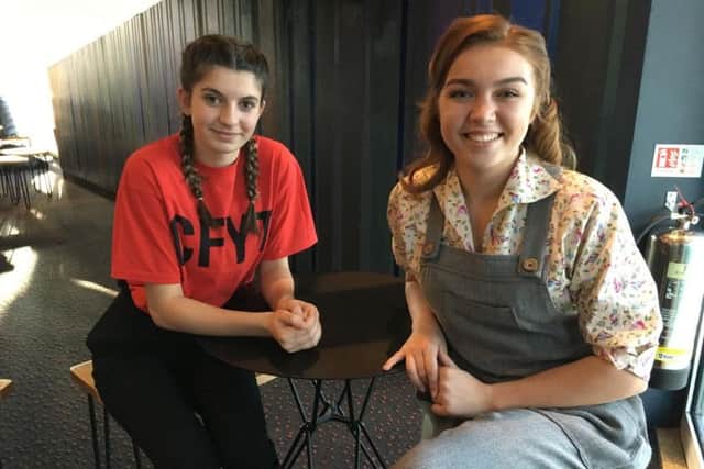 Chichester Festival Youth Theatre members Evie Carter, 15, (left) and Gemma Sangster, 19, who performed to The Queen