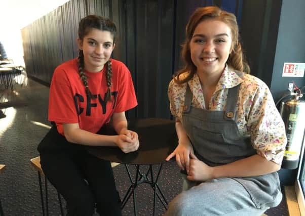 Chichester Festival Youth Theatre members Evie Carter, 15, (left) and Gemma Sangster, 19, who performed to The Queen