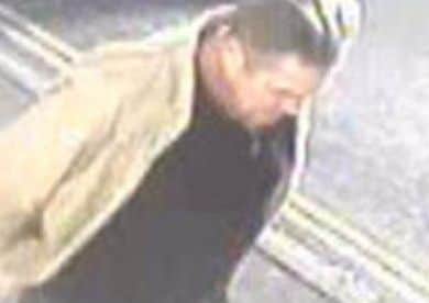 CCTV released after a distraction burglary in Hambrook Road, Gosport. The image shows a man wearing a light coloured jacket on San Diego Road on November 8.