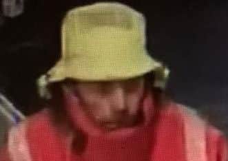 CCTV released after a distraction burglary in Reed Road, Gosport. It shows an image of a man wearing a hat and a red coat at Morrisons, in Gosport, found as part of police enquiries into the burglary at Reed Road on Wednesday November 29.