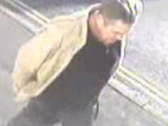 CCTV released after a distraction burglary in Hambrook Road, Gosport. The  image shows a man wearing a light coloured jacket on San Diego Road on November 8.
