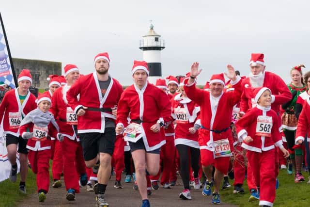 They're off! The start of the Santa Fun Run in Southsea    
Picture: Duncan Shepherd