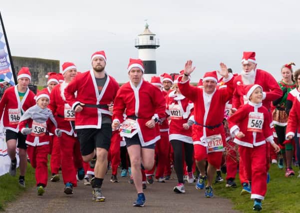 They're off! The start of the Santa Fun Run in Southsea    
Picture: Duncan Shepherd