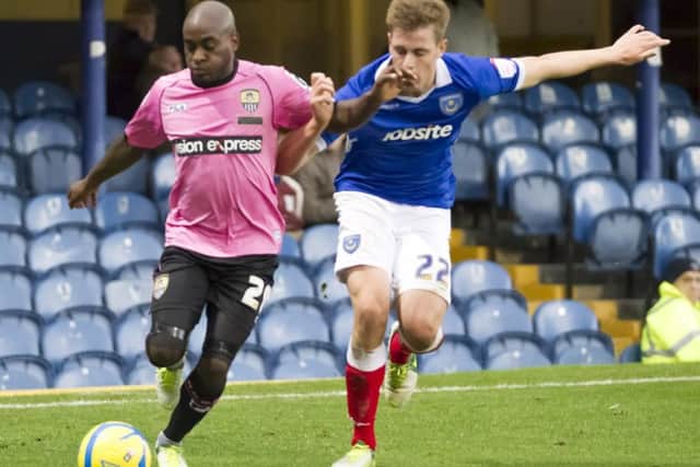 Jamal Campbell-Ryce tussles with Adam Webster in Pompey's FA Cup loss against Notts County on November 3, 2012. Picture: Barry Zee