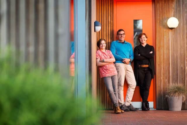 Eva and Julian Sutherland at their home with architect Ruth Butler