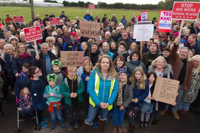 Protest organiser Rachel Follett (centre front) with fellow local residents 
Pictures: Duncan Shepherd (171649_010)