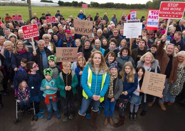 Protest organiser Rachel Follett (centre front) with fellow local residents 

Pictures: Duncan Shepherd (171649_010)