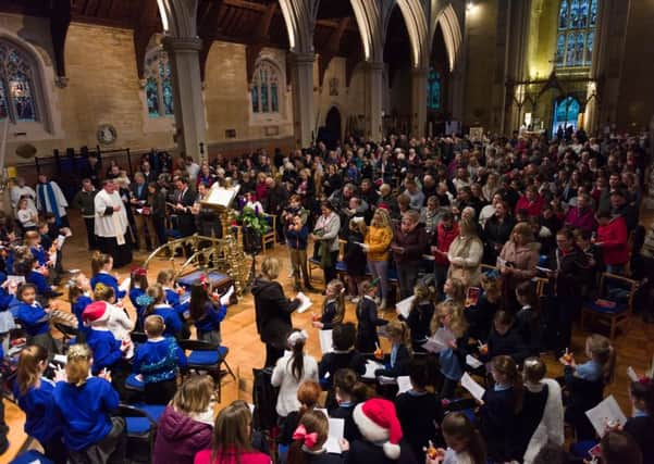 A packed congregation at St Mary's Church, Fratton, enjoy the carol service, led by Father Bob White
Pictures: Duncan Shepherd (171650_022)