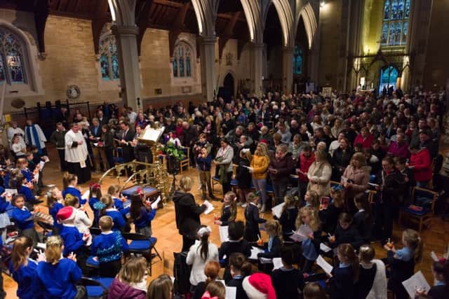 A packed congregation at St Mary's Church, Fratton, enjoy the carol service, led by Father Bob White
Pictures: Duncan Shepherd (171650_022)