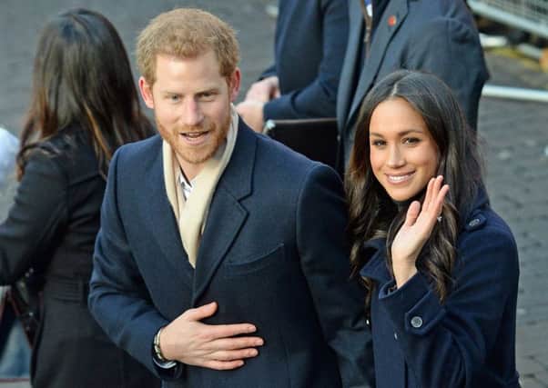 Months of gossiping ahead... Prince Harry with fiancee Meghan Markle. Picture:  Joe Giddens/PA Wire