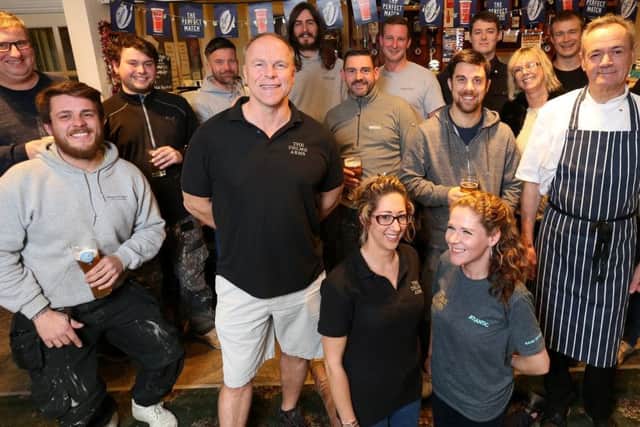 Landlord Neil Matthews (front, in shorts), staff and regulars celebrate at The Delme Arms     Pictures: Chris Moorhouse