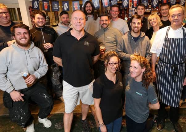 Landlord Neil Matthews (front, in shorts), staff and regulars celebrate at The Delme Arms     Pictures: Chris Moorhouse