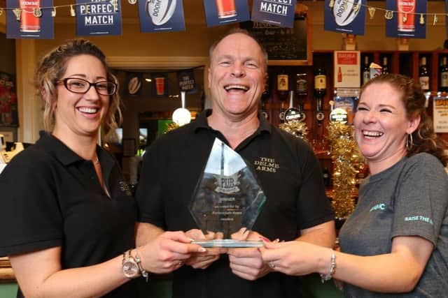 Pub of the year landlord Neil Matthews with Sarah Ecclestone and Claire Levy