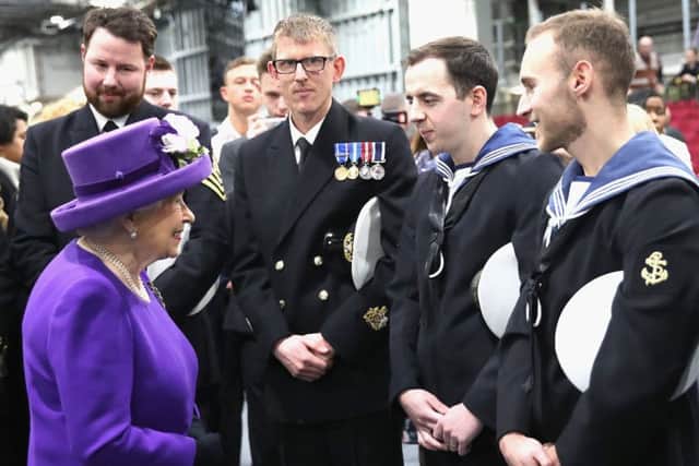 The Queen talks to members of the ship's company, during the commissioning of HMS Queen Elizabeth at Portsmouth Naval Base
Chris Jackson/PA Wire