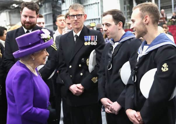 The Queen talks to members of the ship's company, during the commissioning of HMS Queen Elizabeth at Portsmouth Naval Base
Chris Jackson/PA Wire