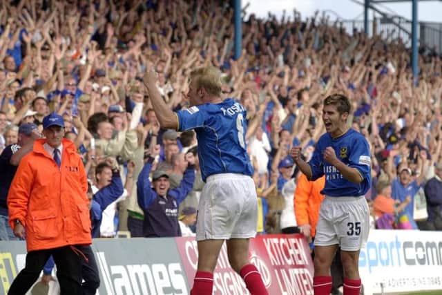 Robert Prosinecki salutes the North Stand after netting an injury-time winner against Gillingham at Fratton Park