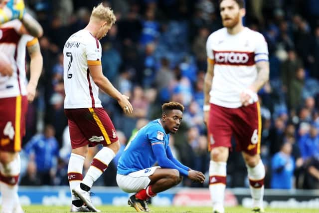 Pompey's Jamal Lowe cuts a frustrated figure after Bradford's smash-and-grab raid. Picture: Joe Pepler