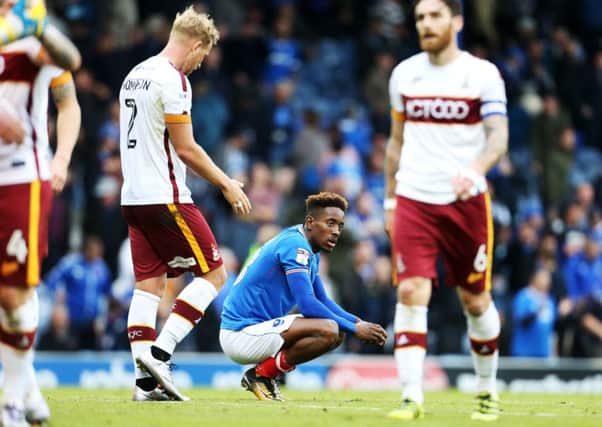 Pompey's Jamal Lowe cuts a frustrated figure after Bradford's smash-and-grab raid. Picture: Joe Pepler