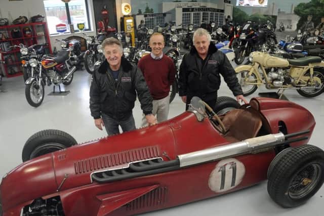 Martin Webb, right, and Ray Waller, left, of Comet Classics in Southbourne with the Team Ant racing car they bought at auction and Southbourne car enthusiast Darren Collins, who helped build it. Picture Ian Hargreaves (171671-1)