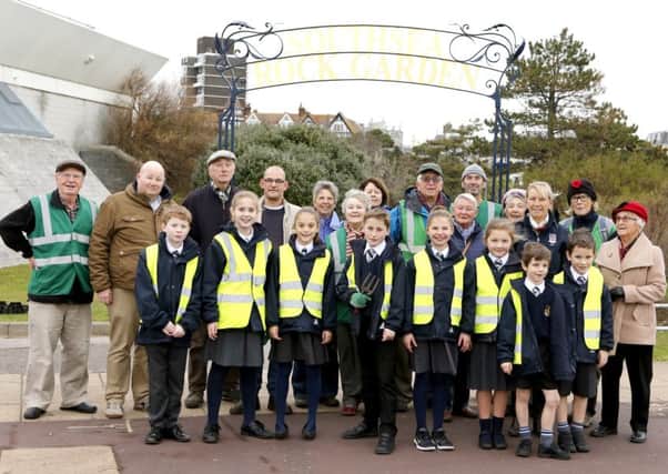 Friends of Southsea Rock Gardens with pupils from St Johns College and the makers of the ornate arch. Picture: Habibur Rahman
