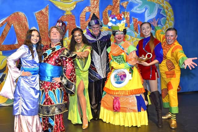 From left: Princess So Shi (Divine Cresswell), The Emperor (Matt Devitt), Genie of the Ring (Karis Anderson), Abanazaar (Clive Mantle), Widow Twankey (Mark Siney), Aladdin (Danielle Haywood) and Wishee Washee (Christain Lee). (171167-1)
