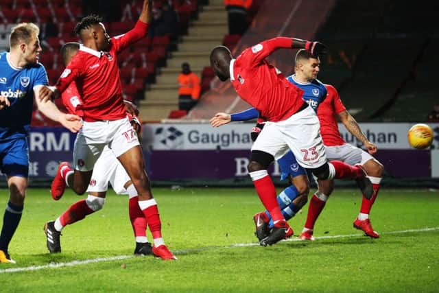 Stuart O'Keefe and defender Josh Magennis both appear to get a touch on Gareth Evans' cross - the important thing was that it ended in the net Picture: Joe Pepler
