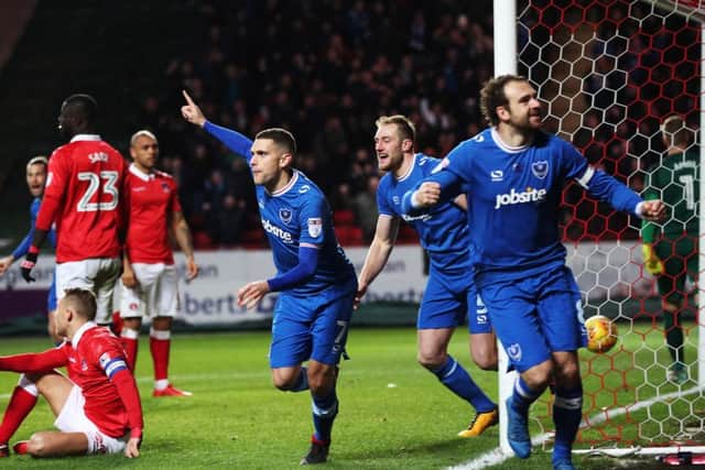 Pompey celebrate after Josh Magennis put the ball into his own net at Charlton Picture: Joe Pepler