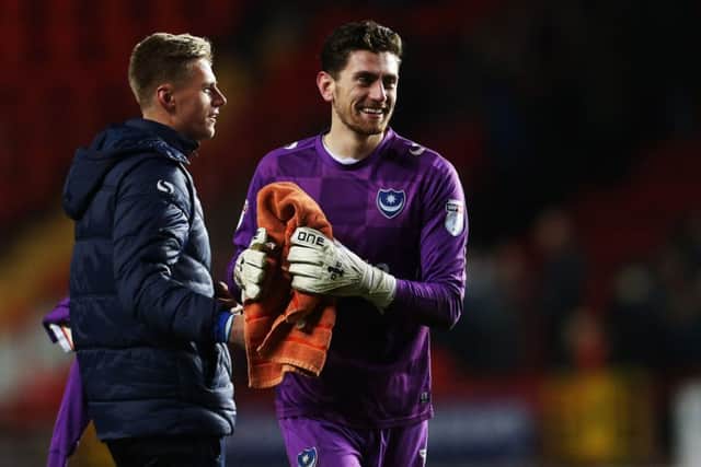 Luke McGee, right, is congratulated by Alex Bass after Pompey's 1-0 victory at Charlton. Picture: Joe Pepler