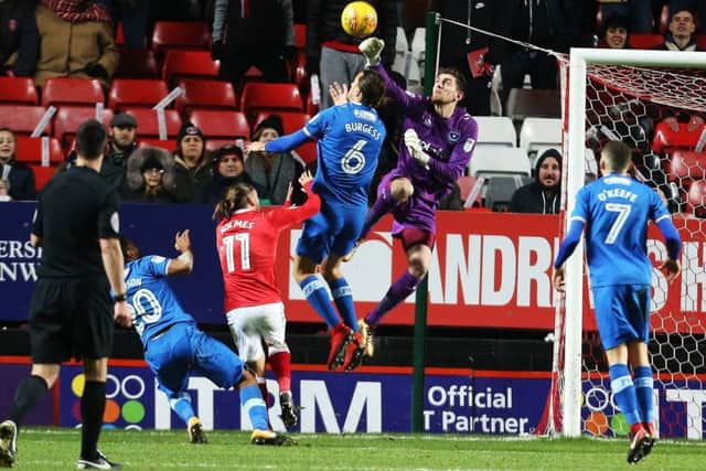 Luke McGee punches an aerial ball clear. Picture: Joe Pepler