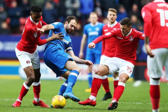 Brett Pitman is surrounded by a swarm of Charlton players. Picture: Joe Pepler