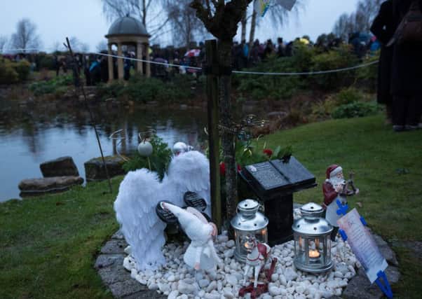 Lanterns were lit and placed at memorials to loved ones           Picture: Vernon Nash