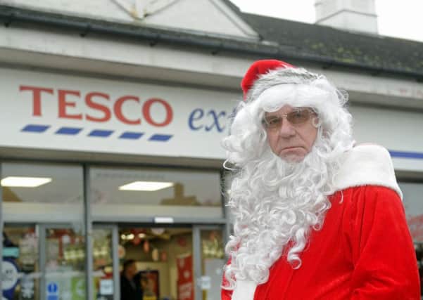 Rod Elliott, Hayling Island Lions Club volunteer Santa, outside Tesco Express, Station Road, Hayling Island. He was thrown off the site on Saturday after coming to give children presents and fundraise near the store's entrance. Picture: Ian Hargreaves
