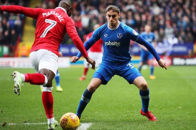 Brandon Haunstrup attempts to block Mark Marshall's cross during Saturday's League One game at The Valley.