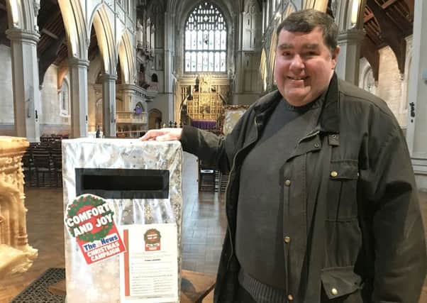The Rev Canon Bob White with the Christmas campaign postbox
Picture: Byron Melton